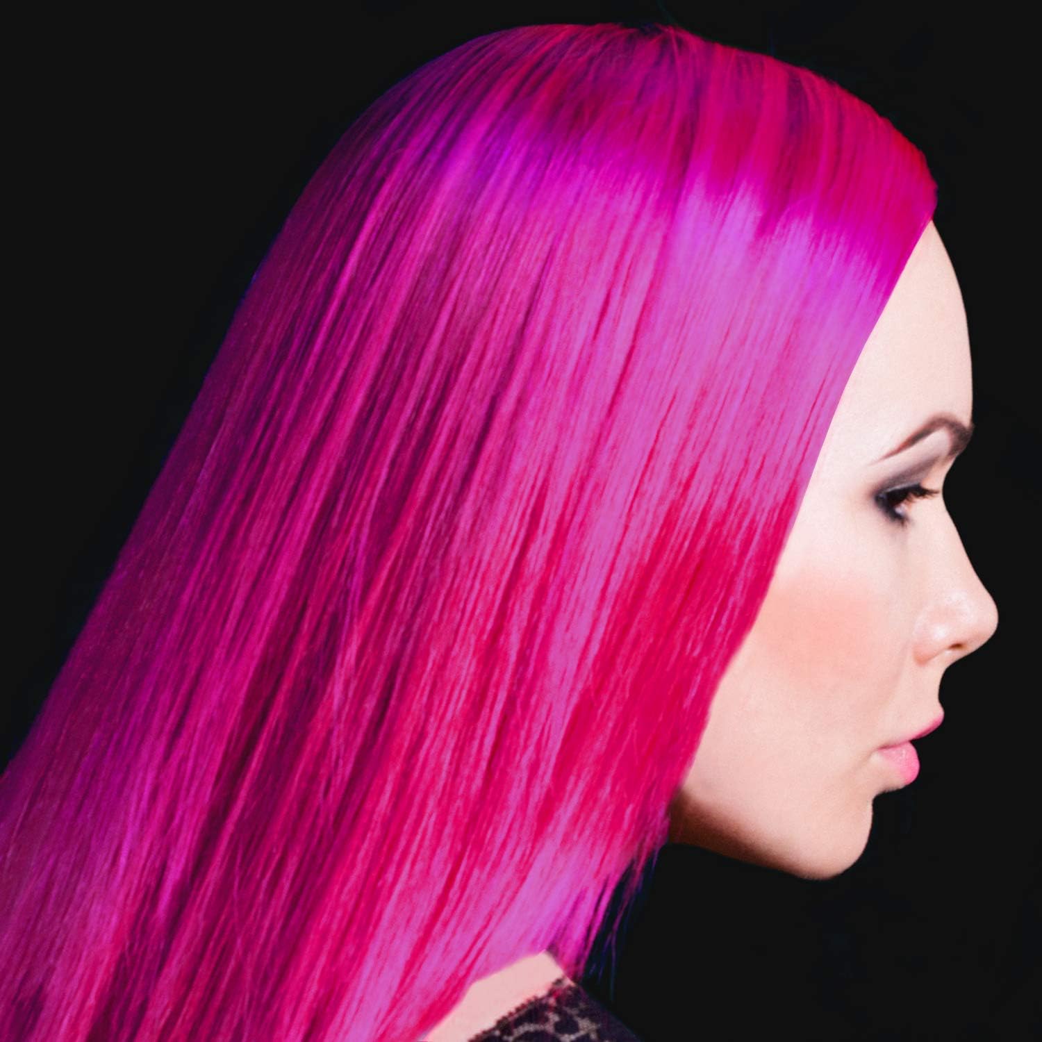 Woman with pink hair using manic panic semi - permanent hair color cream in hot hot pink.