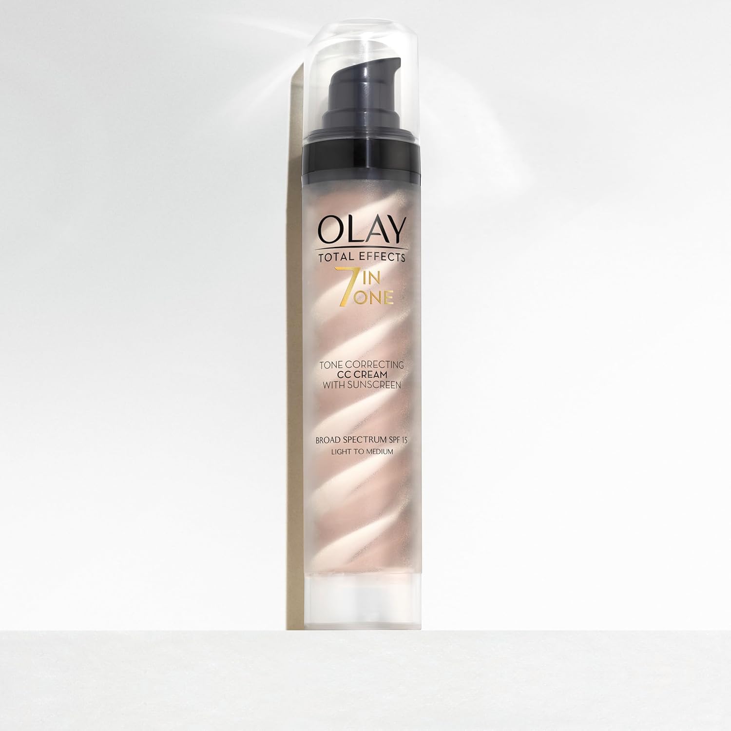 Pump bottle of Olay total effects 7-in-1 tone correcting CC cream with sunscreen, broad spectrum SPF 15 light to medium shade.
