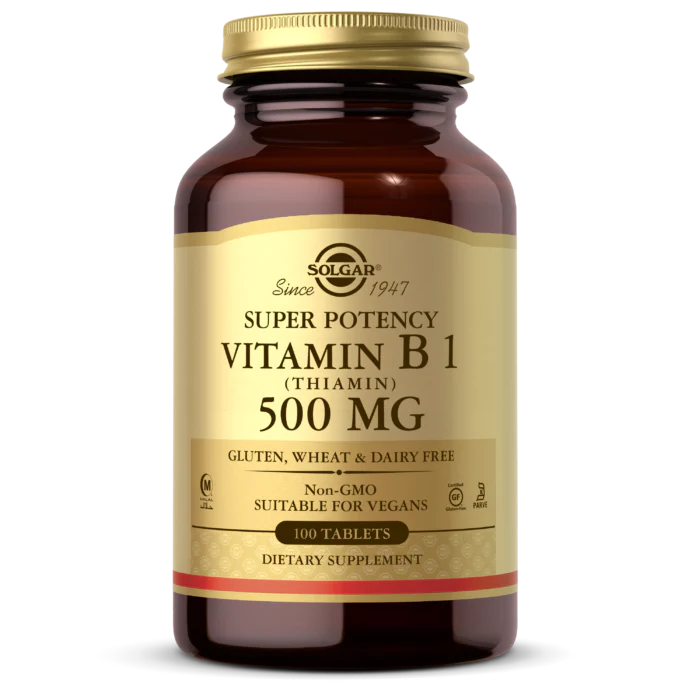 A bottle of Solgar Vitamin B1 500 MG with 100 tablets, labeled as suitable for vegans and free from gluten, wheat, and dairy.