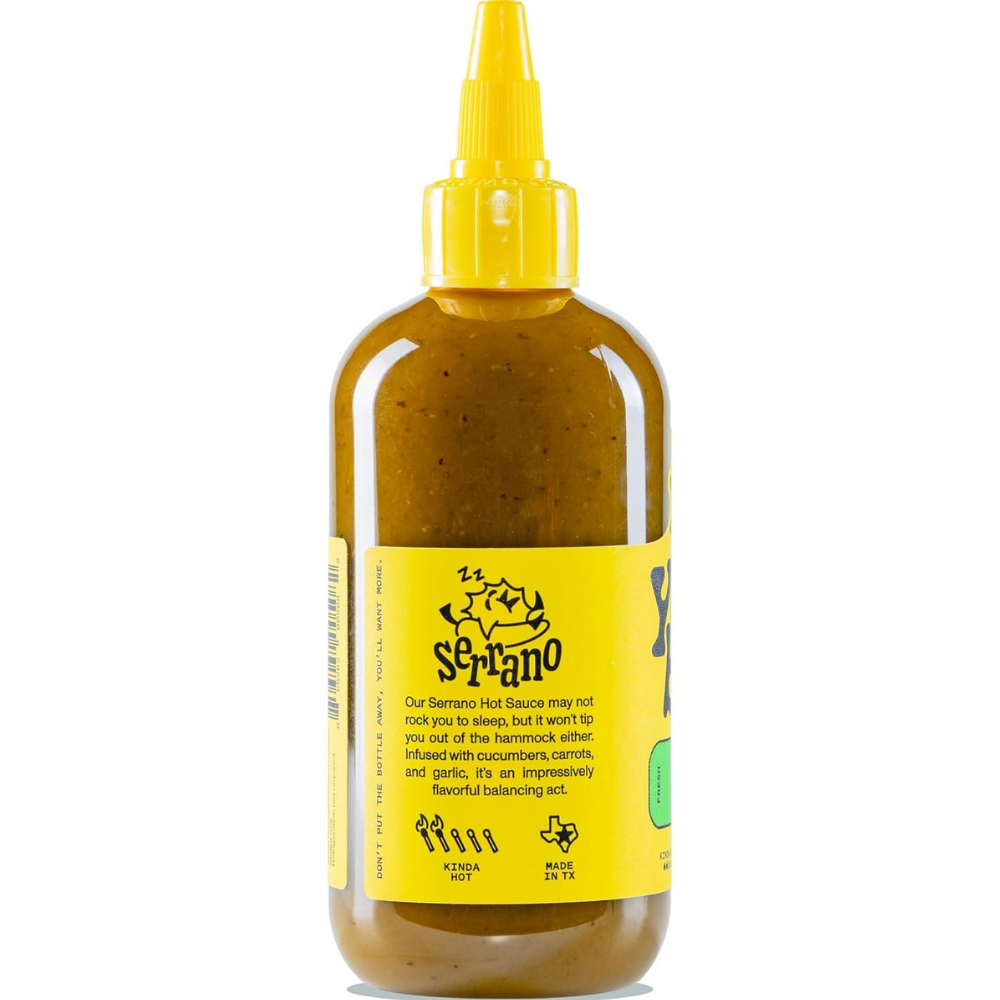 Side of a bottle of Yellowbird Serrano hot sauce with a kinda hot description.