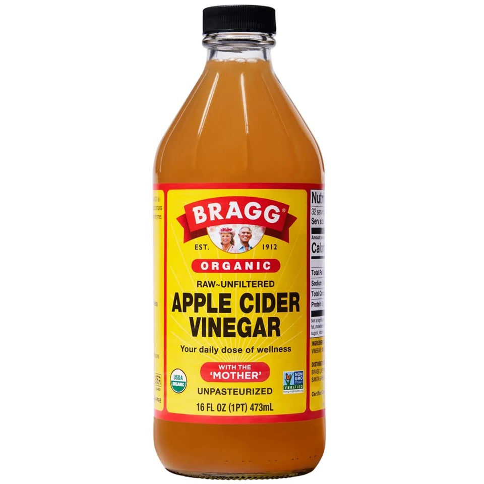 Bottle of Bragg Organic raw unfiltered apple cider vinegar for your daily does of wellness. 