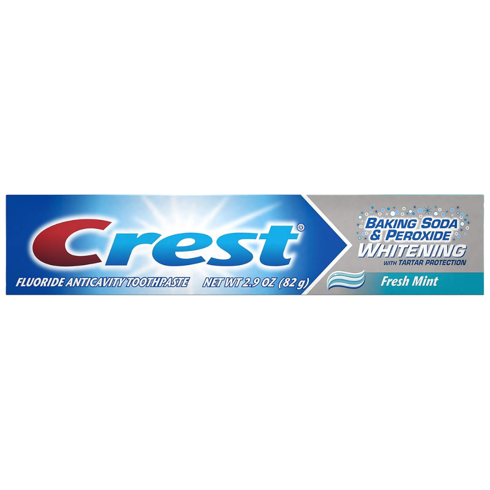Box of Crest fluoride anti cavity toothpaste with baking soda & peroxide whitening with tartar protection for teeth whitening. 